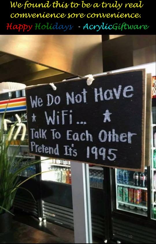 A chalkboard sign in a convenience store states, "We Do Not Have WiFi... Talk To Each Other Pretend It's 1995," encouraging social interaction.