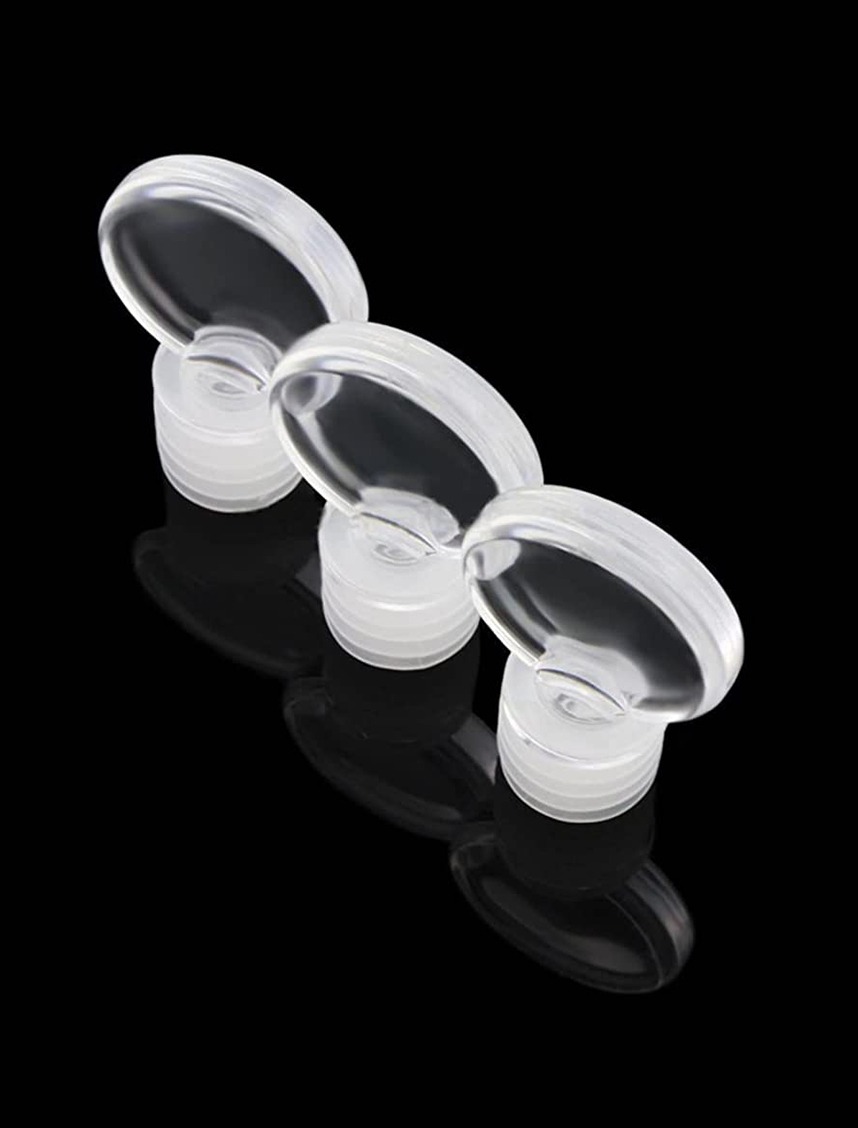 Three transparent plastic bottle caps with a circular, flip-top design placed on a reflective black surface. Ideal for organizing and storing liquids.