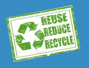 Green stamp featuring the phrases "Reuse, Reduce, Recycle" alongside a recycling symbol, promoting environmental sustainability and waste reduction.